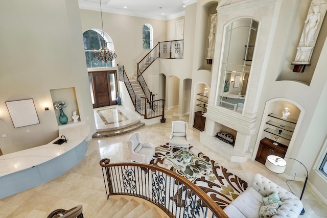 interior space featuring a high ceiling, an inviting chandelier, and crown molding