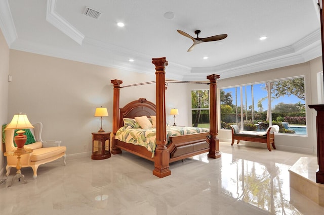 bedroom featuring ceiling fan, ornamental molding, and a tray ceiling