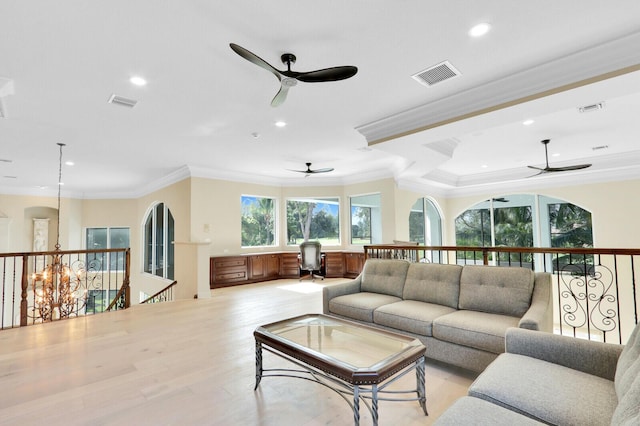 living room with crown molding and light hardwood / wood-style flooring