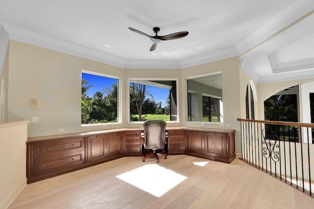 home office featuring ceiling fan, crown molding, and light hardwood / wood-style flooring