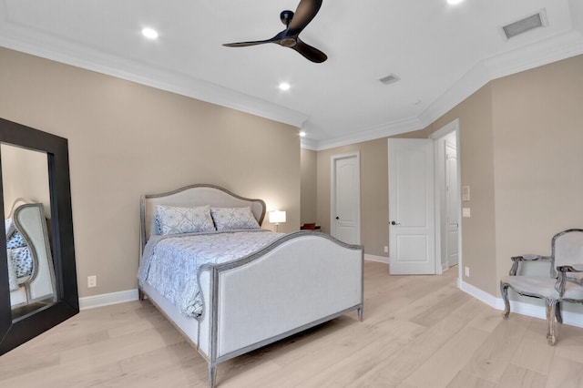 bedroom featuring light wood-type flooring, ceiling fan, and ornamental molding