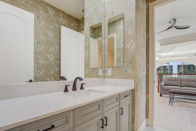 bathroom featuring ceiling fan and vanity