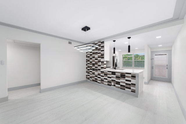 living room with light hardwood / wood-style floors and sink