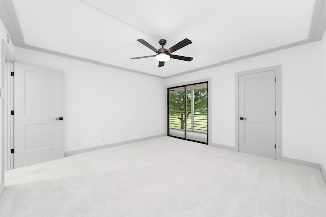 unfurnished room with light carpet, ceiling fan, and crown molding