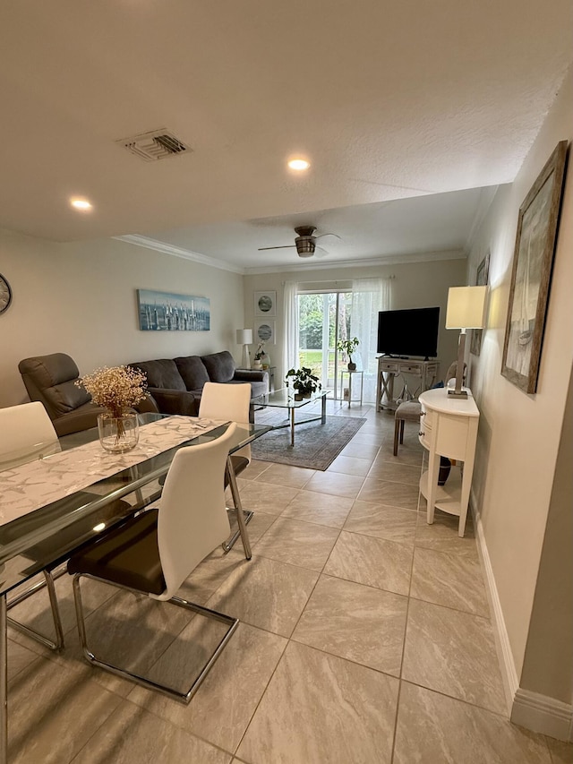 living room with ceiling fan, light tile patterned flooring, and ornamental molding