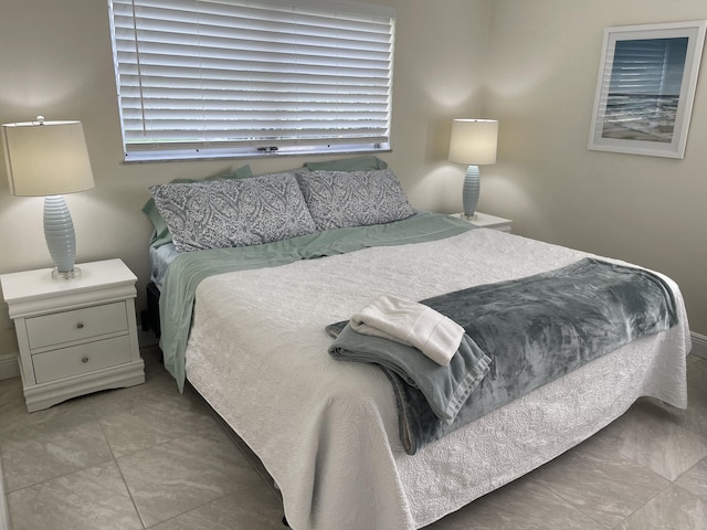 bedroom with light tile patterned flooring