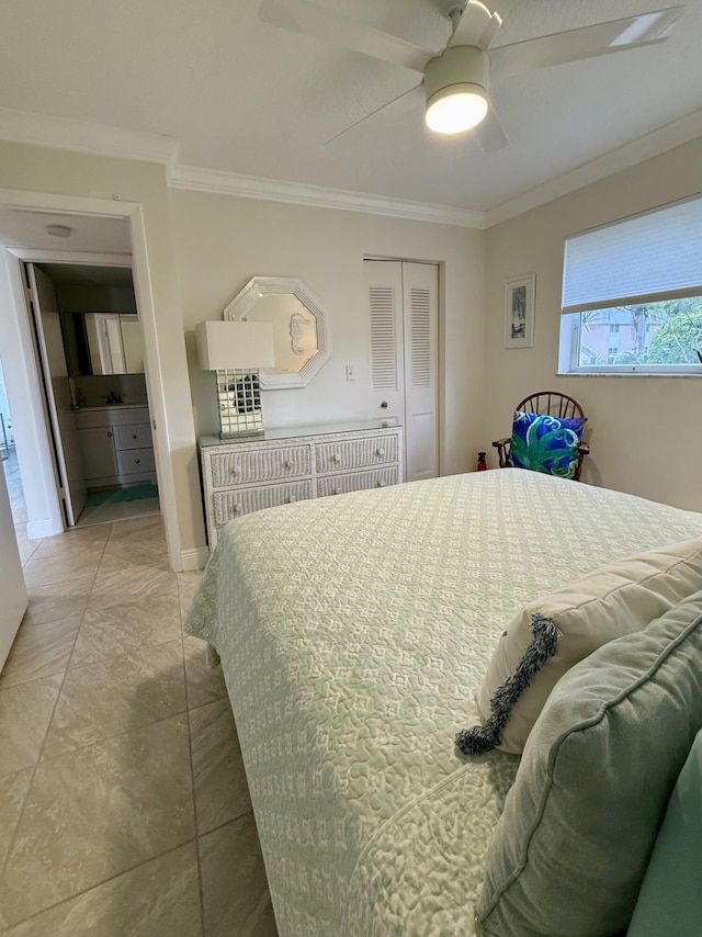 bedroom with ceiling fan, ornamental molding, and a closet