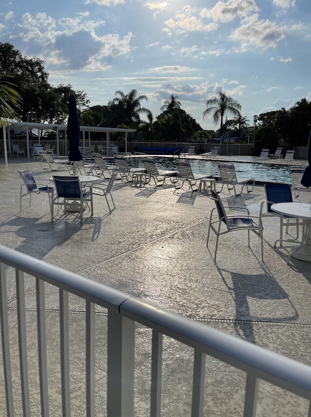 view of swimming pool featuring a patio area