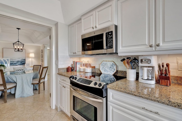 kitchen with an inviting chandelier, backsplash, decorative light fixtures, white cabinets, and appliances with stainless steel finishes