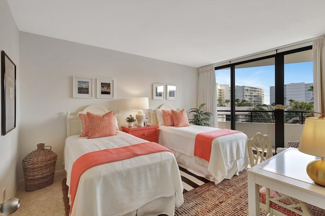 carpeted bedroom with expansive windows