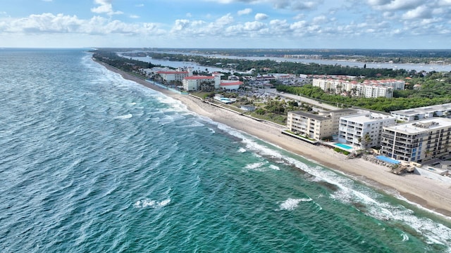 aerial view with a water view and a view of the beach