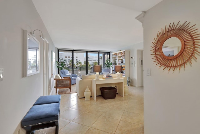 tiled living room featuring expansive windows