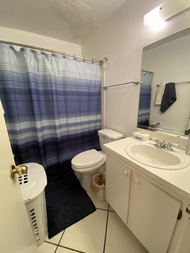 bathroom with tile patterned floors, vanity, toilet, and a shower with curtain