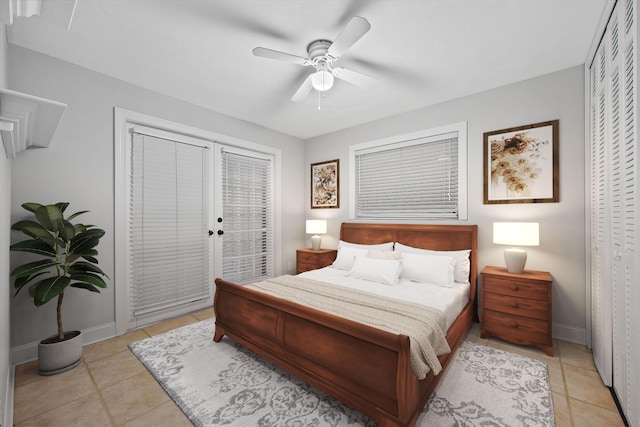 tiled bedroom with access to outside and ceiling fan