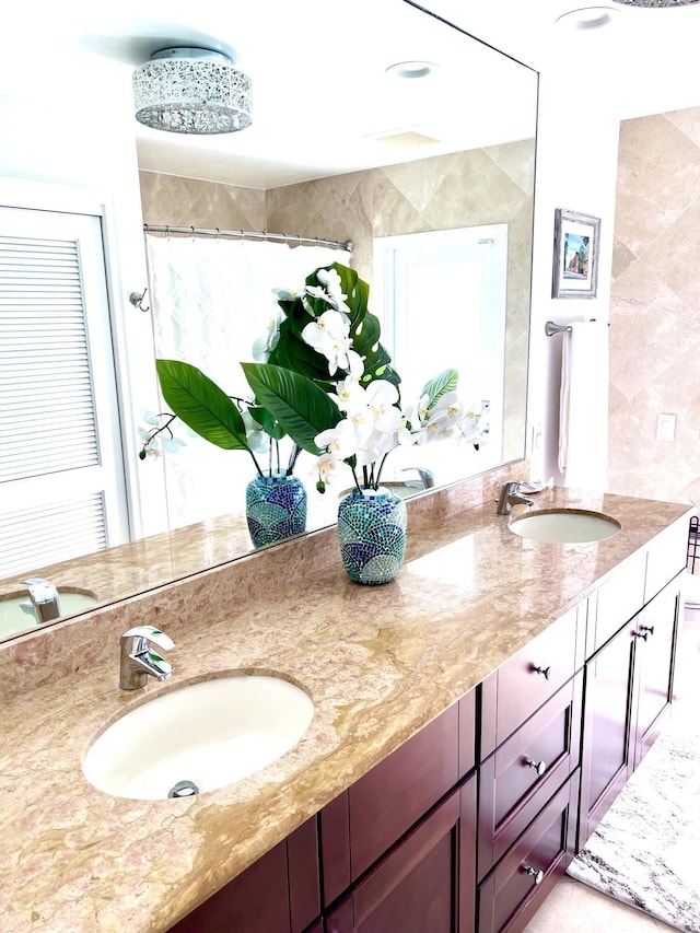 bathroom with vanity and curtained shower