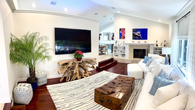 living room with hardwood / wood-style flooring and lofted ceiling