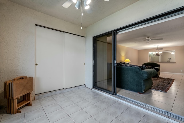 interior space featuring a textured ceiling and ceiling fan