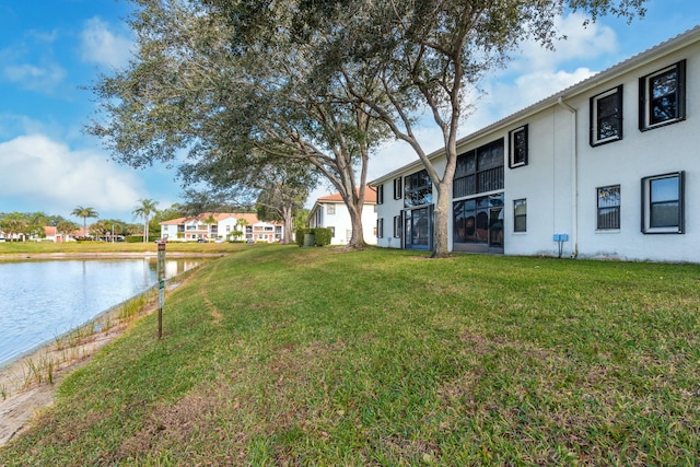 view of yard with a water view