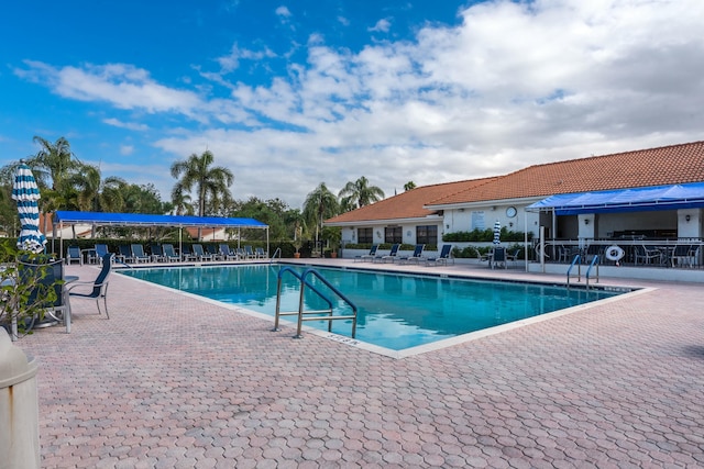 view of swimming pool with a patio area