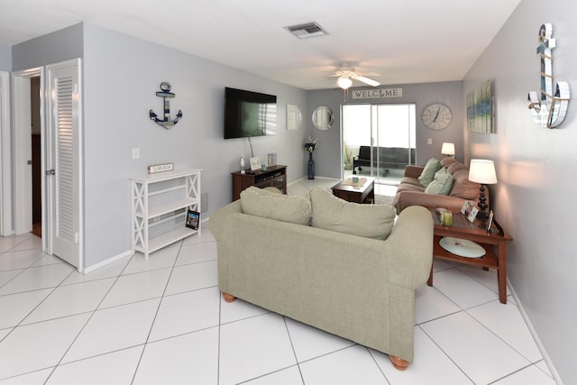 living room featuring ceiling fan and light tile patterned floors