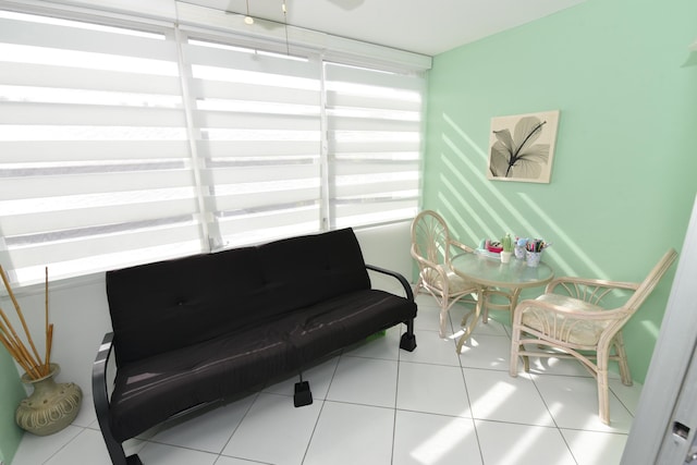 living area with tile patterned floors