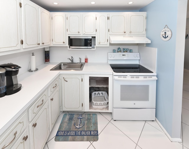 kitchen with white range with electric cooktop, sink, and white cabinets