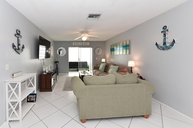 tiled living room featuring ceiling fan