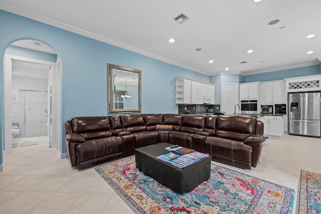 living room featuring crown molding and light tile patterned flooring