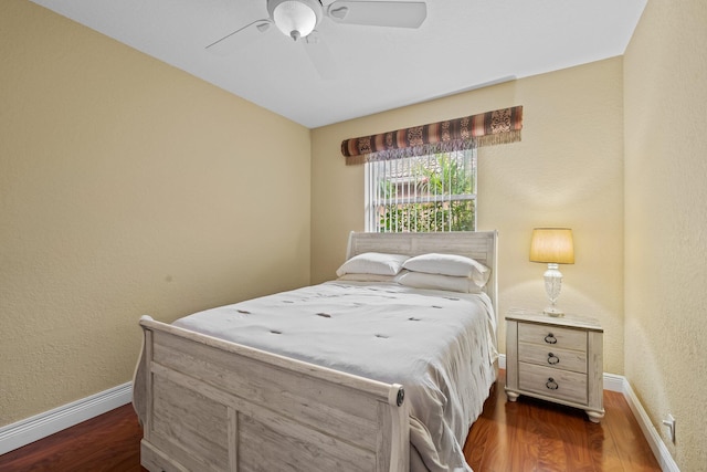 bedroom featuring ceiling fan and dark hardwood / wood-style floors