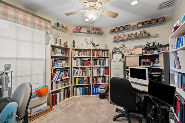 carpeted office with ceiling fan