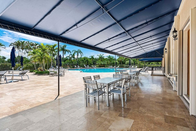 view of swimming pool featuring a patio area