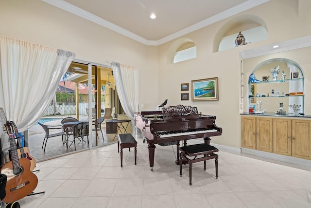 miscellaneous room with crown molding and light tile patterned floors