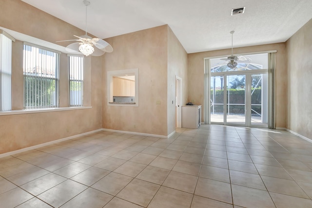 unfurnished dining area featuring a healthy amount of sunlight and light tile patterned flooring