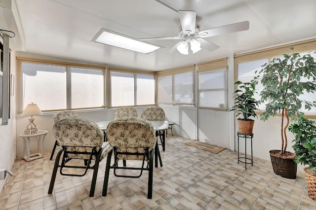 sunroom / solarium with ceiling fan