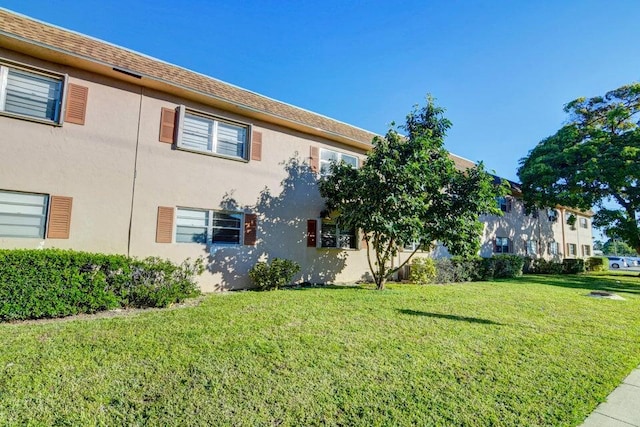 view of home's exterior featuring a lawn