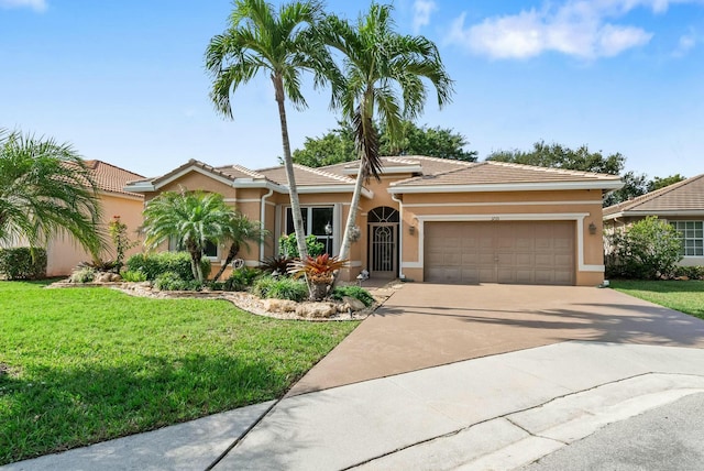 view of front facade featuring a garage and a front lawn