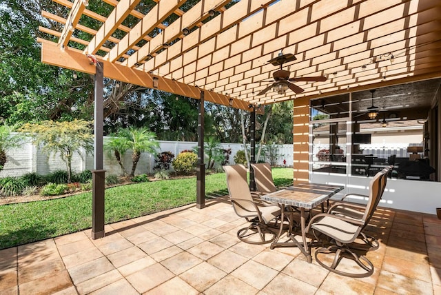 view of patio / terrace with ceiling fan and a pergola