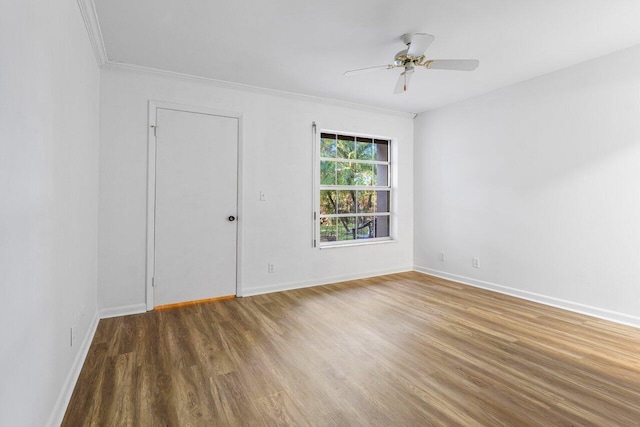 spare room with hardwood / wood-style floors, ceiling fan, and crown molding