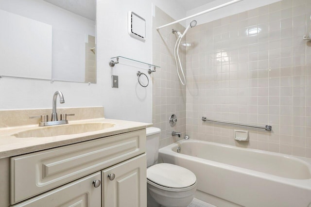 full bathroom featuring vanity, toilet, and tiled shower / bath