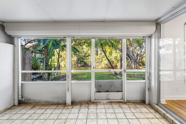 unfurnished sunroom with a wealth of natural light