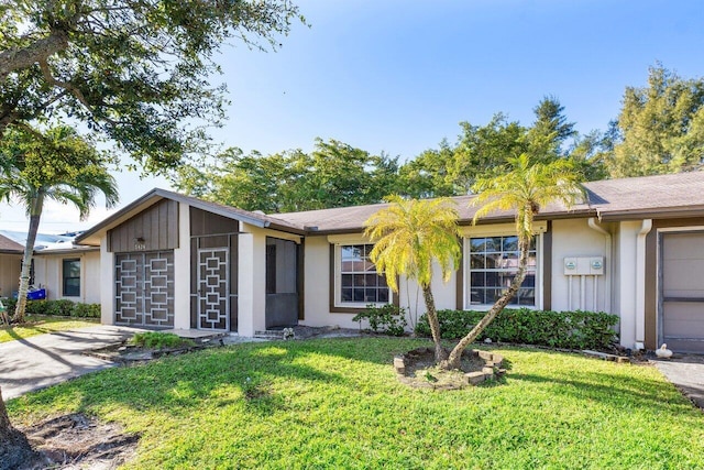 ranch-style house with a front lawn