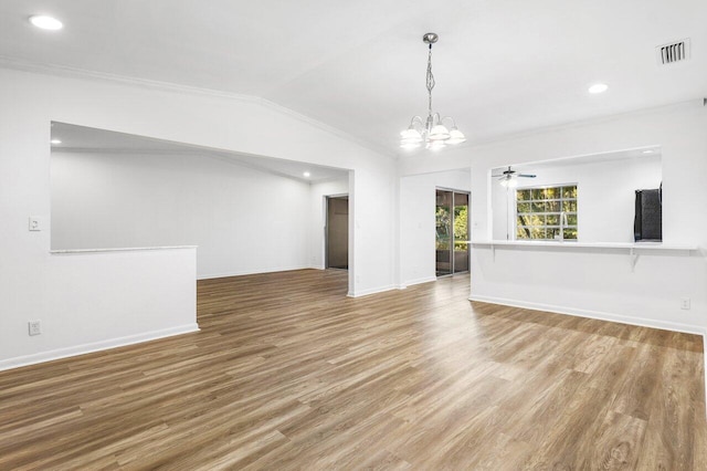 unfurnished living room featuring ceiling fan with notable chandelier, light hardwood / wood-style floors, crown molding, and lofted ceiling