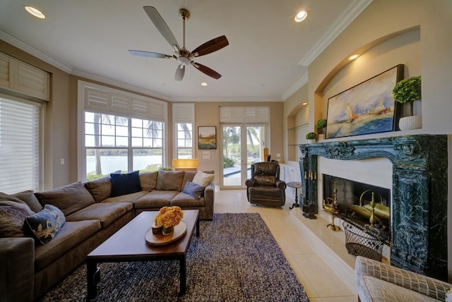 living room with a premium fireplace, crown molding, light tile patterned flooring, and built in features