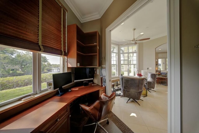 tiled office space with ornamental molding, plenty of natural light, and ceiling fan