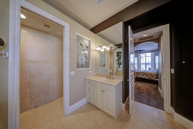 bathroom with tile patterned flooring and vanity