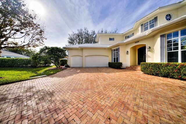 view of front of property with a garage