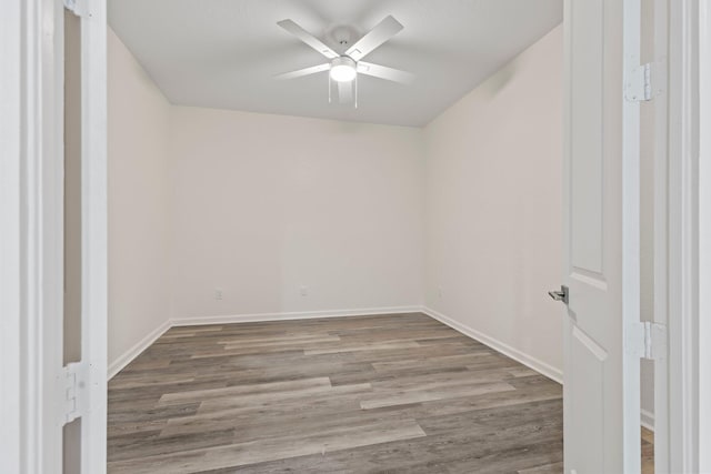 spare room featuring ceiling fan and wood-type flooring