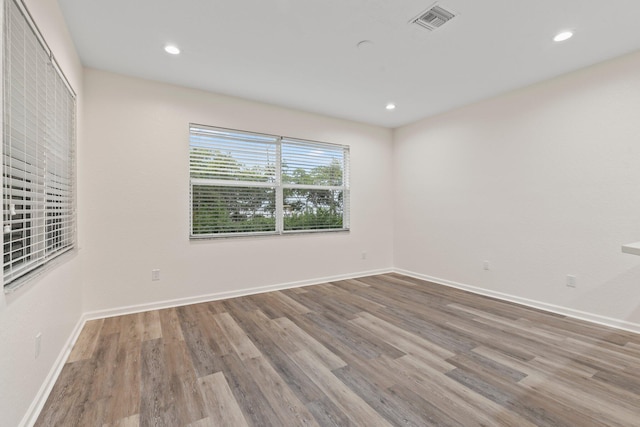 unfurnished room featuring light wood-type flooring