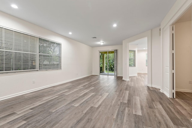 unfurnished living room featuring light wood-type flooring