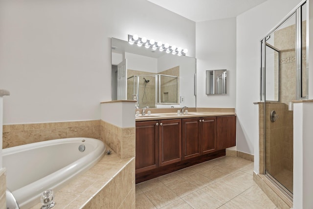 bathroom with tile patterned floors, vanity, and independent shower and bath